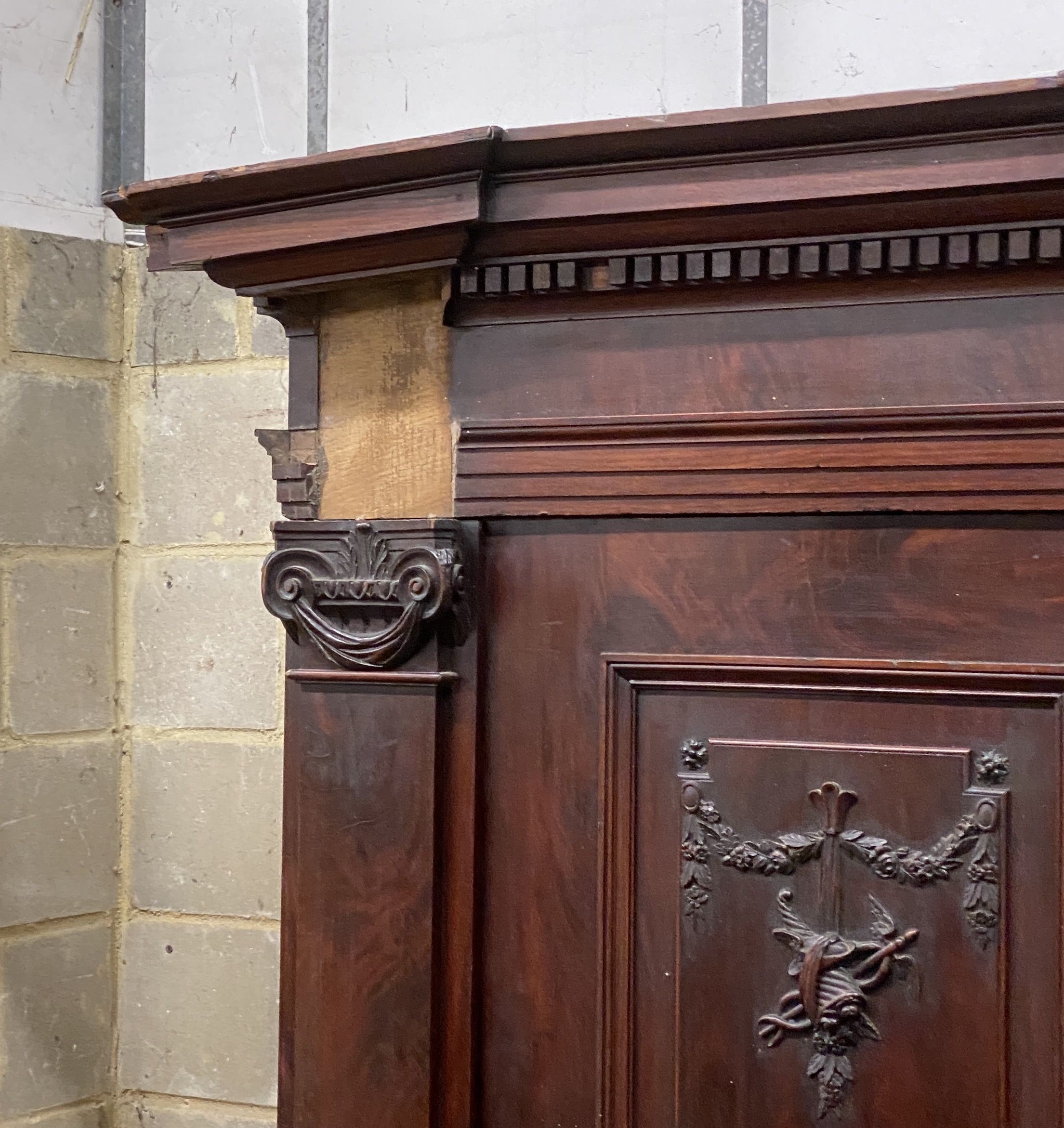 An 18th century carved walnut shrank, length 220cm, depth 73cm, height 216cm